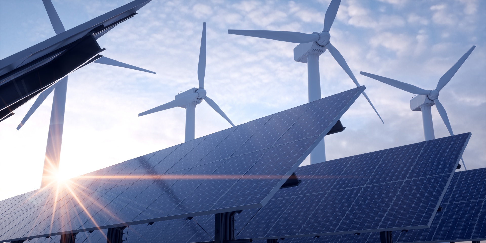 Solar field with wind turbines in the background. Picture by Negro Elkha/Adobe Stock