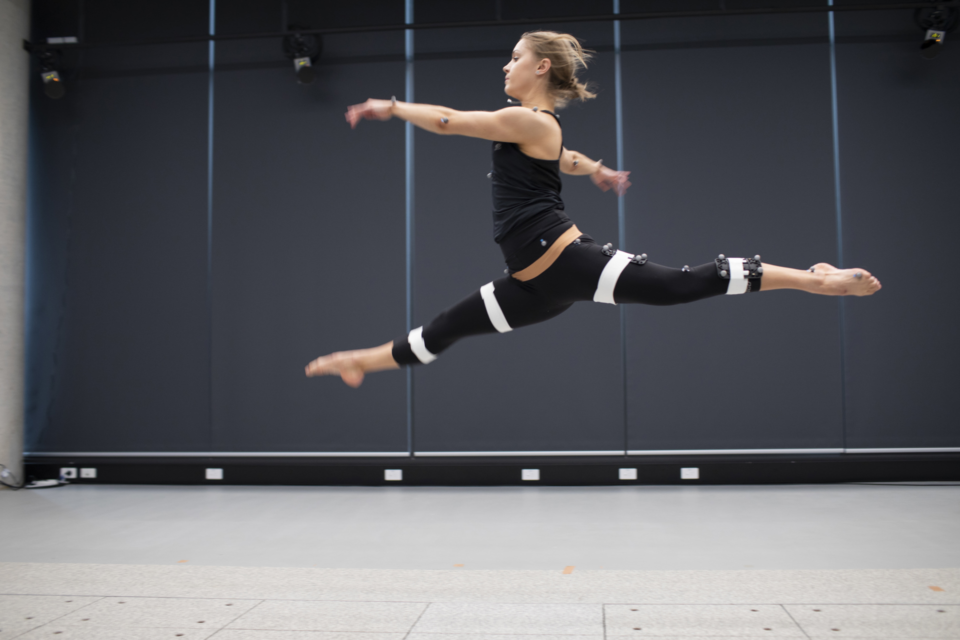 A female leaping in the Human Performance Research Centre.