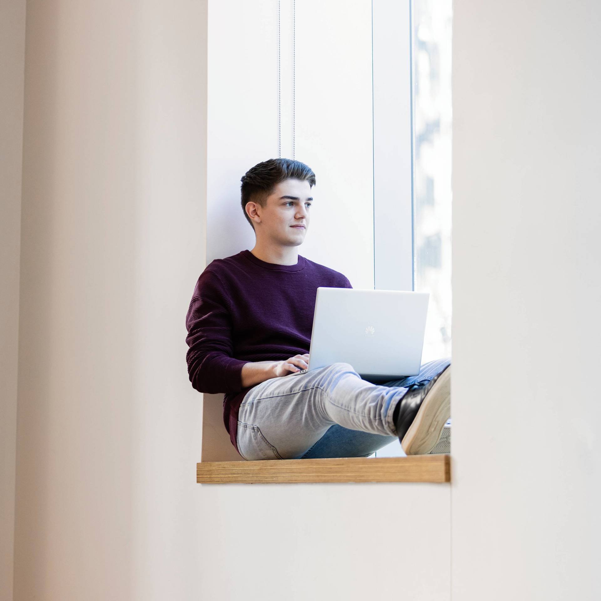 University of Technology Sydney student sitting on a windowsill