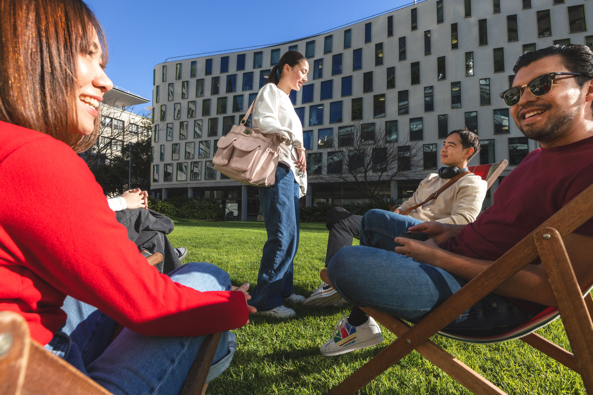 Students relaxing on alumni green.