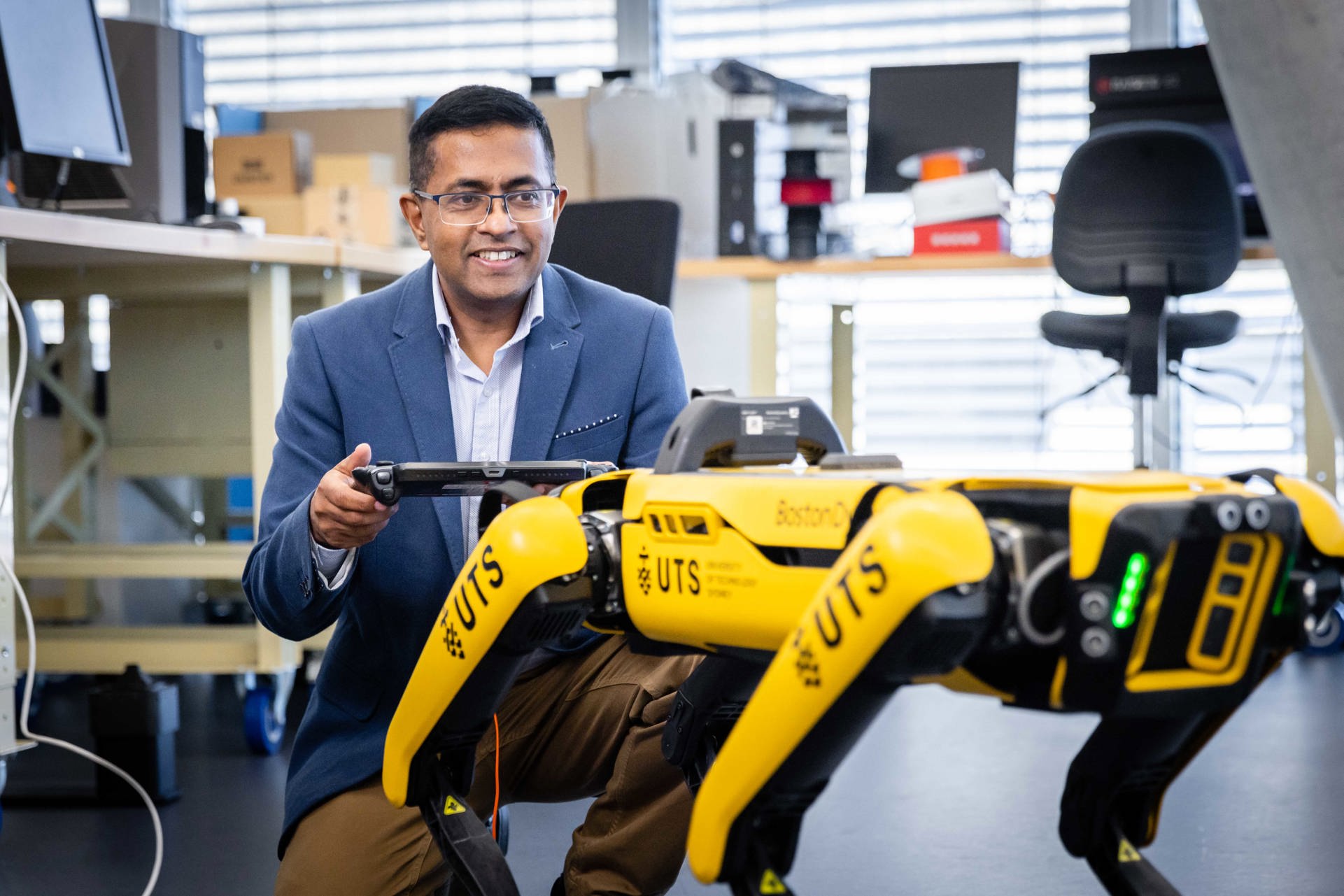 Professor Sarath Kodagoda with the robot dog spot