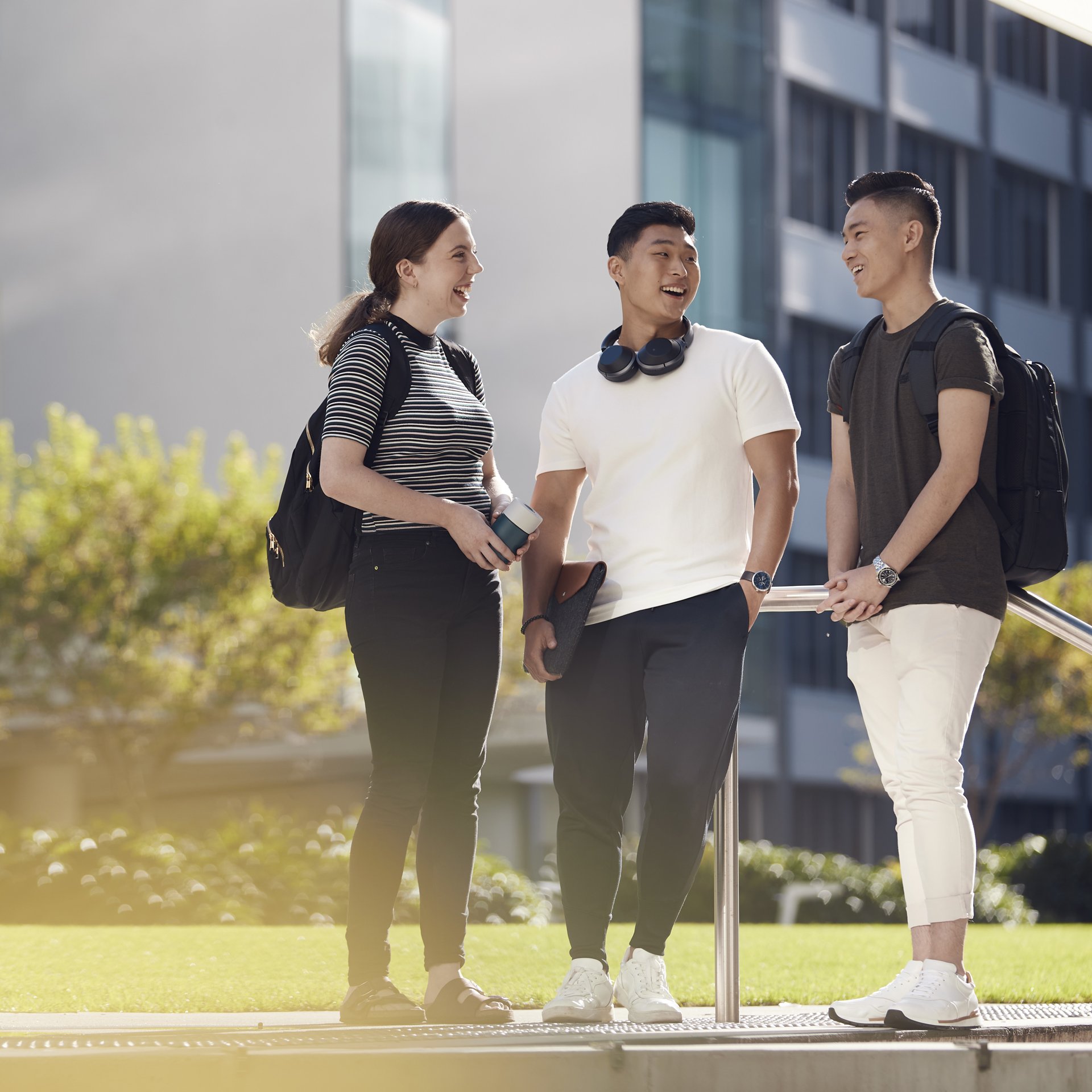 Three students standing outside at the University of Technology Sydney