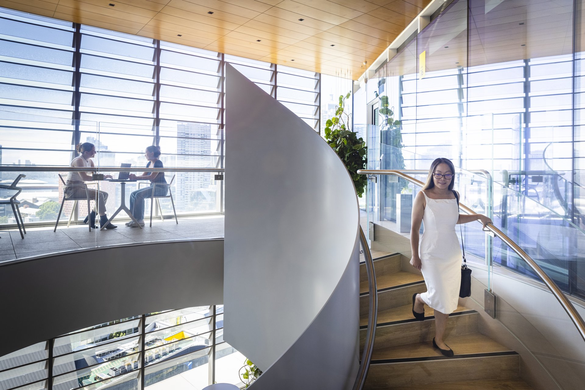 Two people looking over documents in the Faculty of Law at the University of Technology Sydney