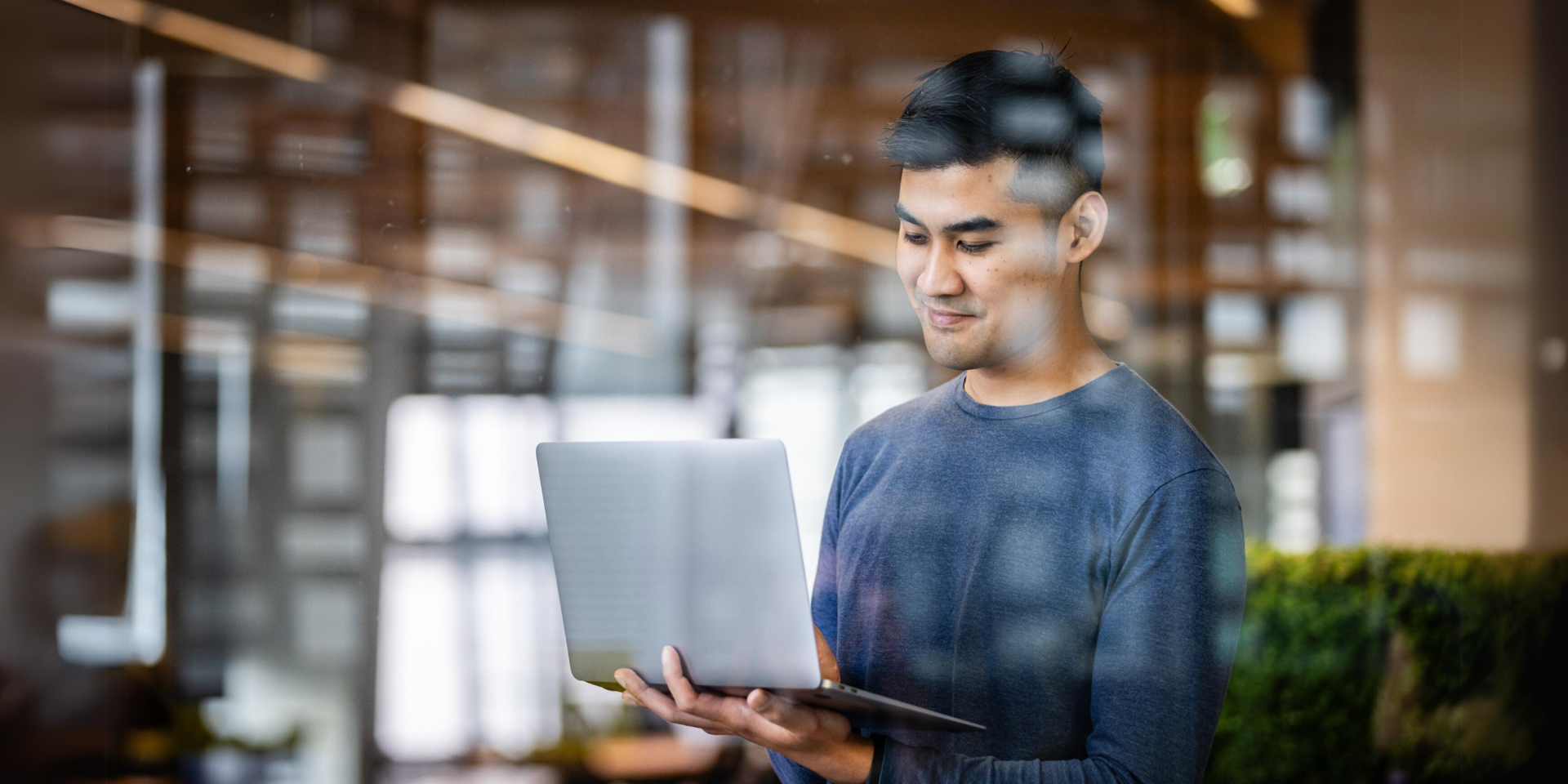 Young man looking at his laptop